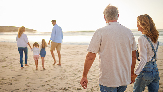 family on beach sunrise