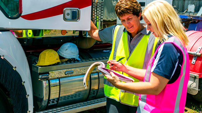 employer with female truck driver