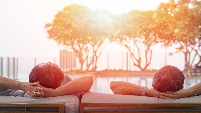 couple in deckchairs watching sunset