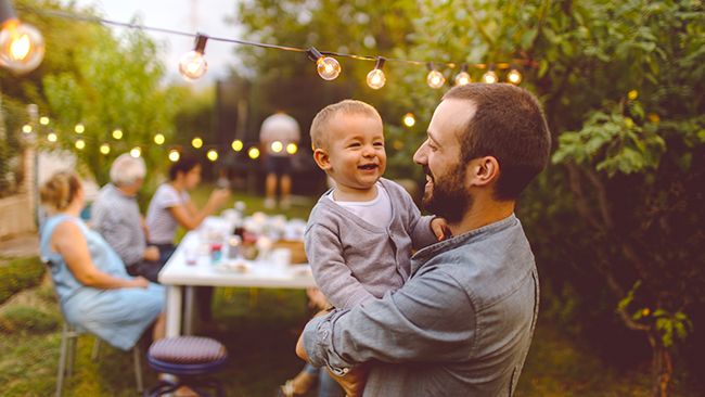 Father and baby at family BBQ