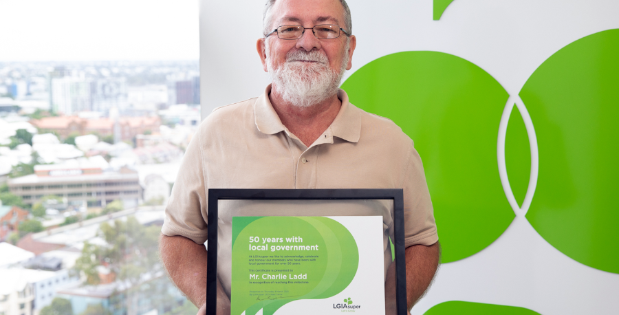 LGIAsuper member Charlie Ladd accepts his certificate for reaching 50 years with local government